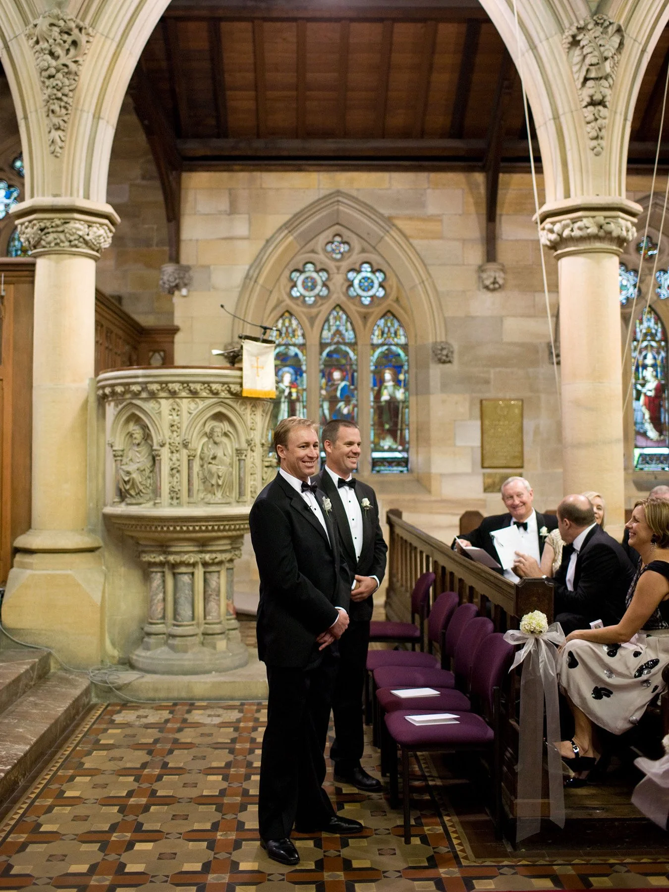 Groom standing at the altar of All Saints Anglican Church Woollahra as guests are seated