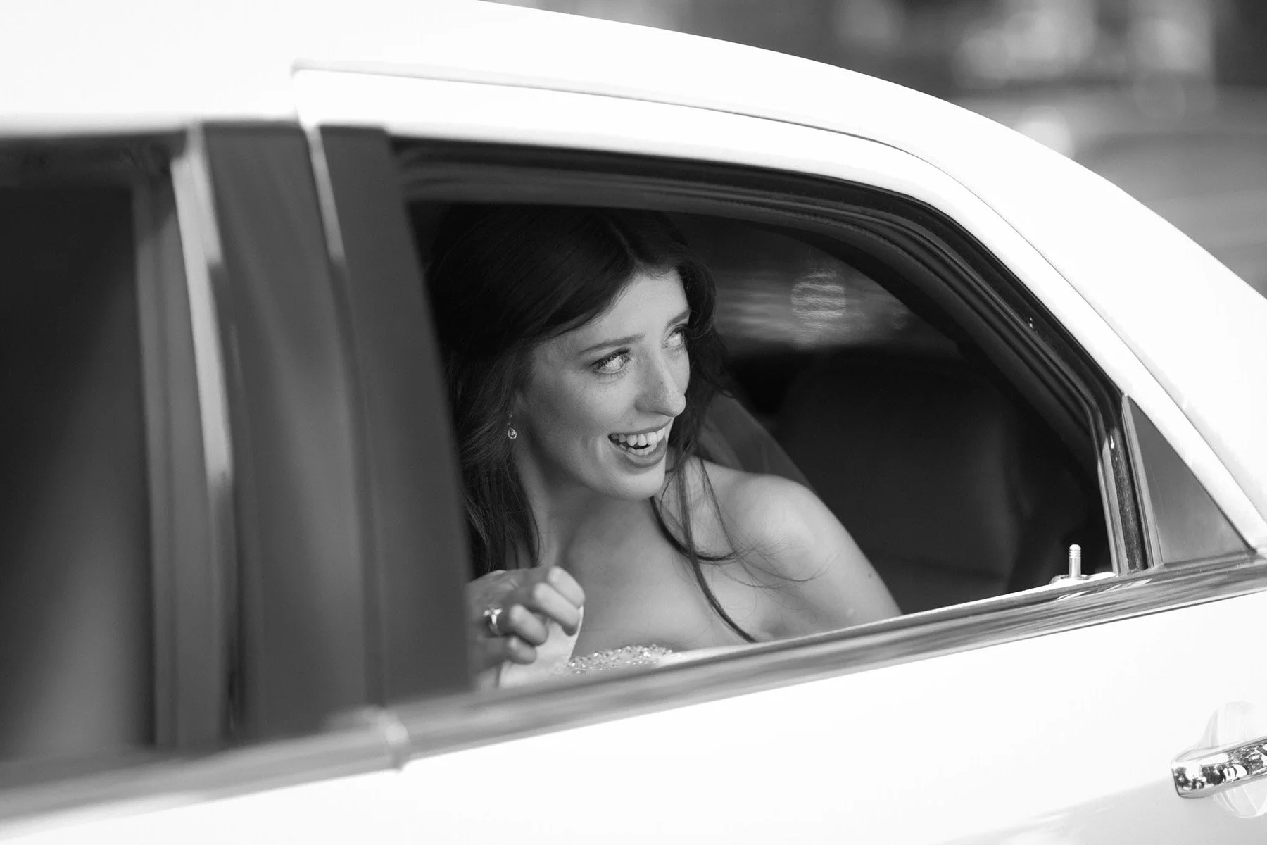 Bride arriving by car at Shore School Chapel, North Sydney