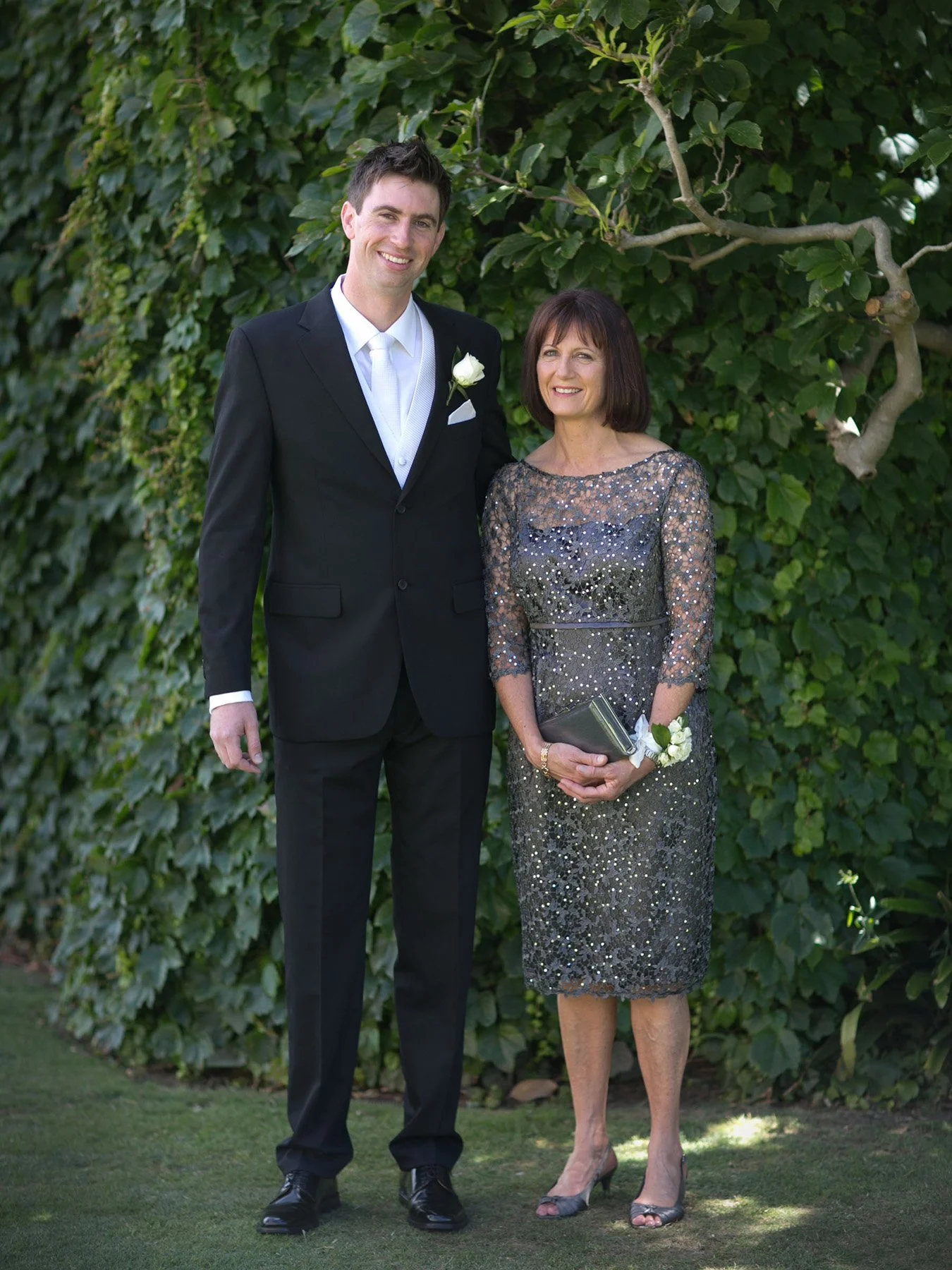 Groom with mum at lawn at Shore School Chapel, North Sydney