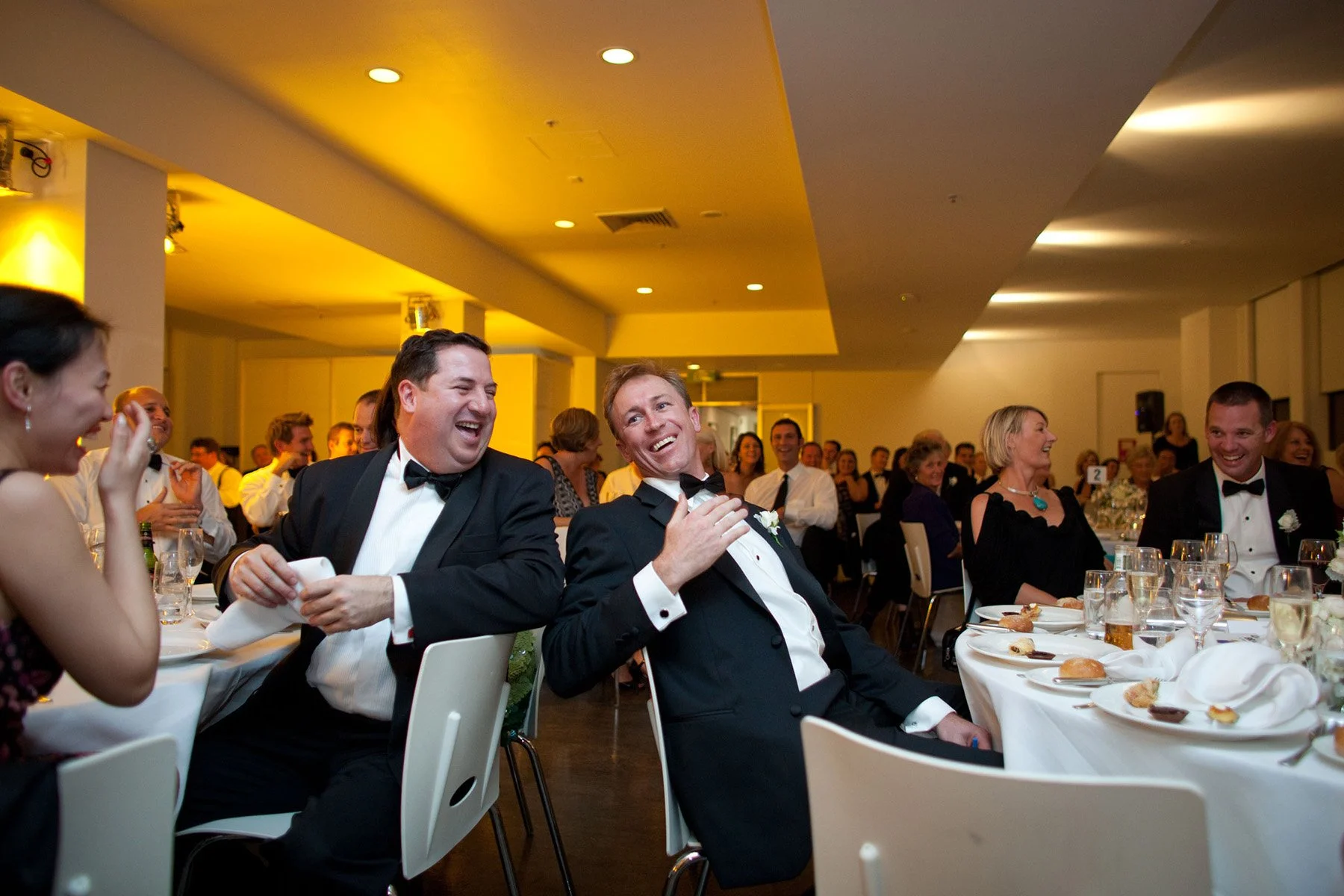 Groom doubled over laughing during speeches at the Museum of Contemporary Art Sydney