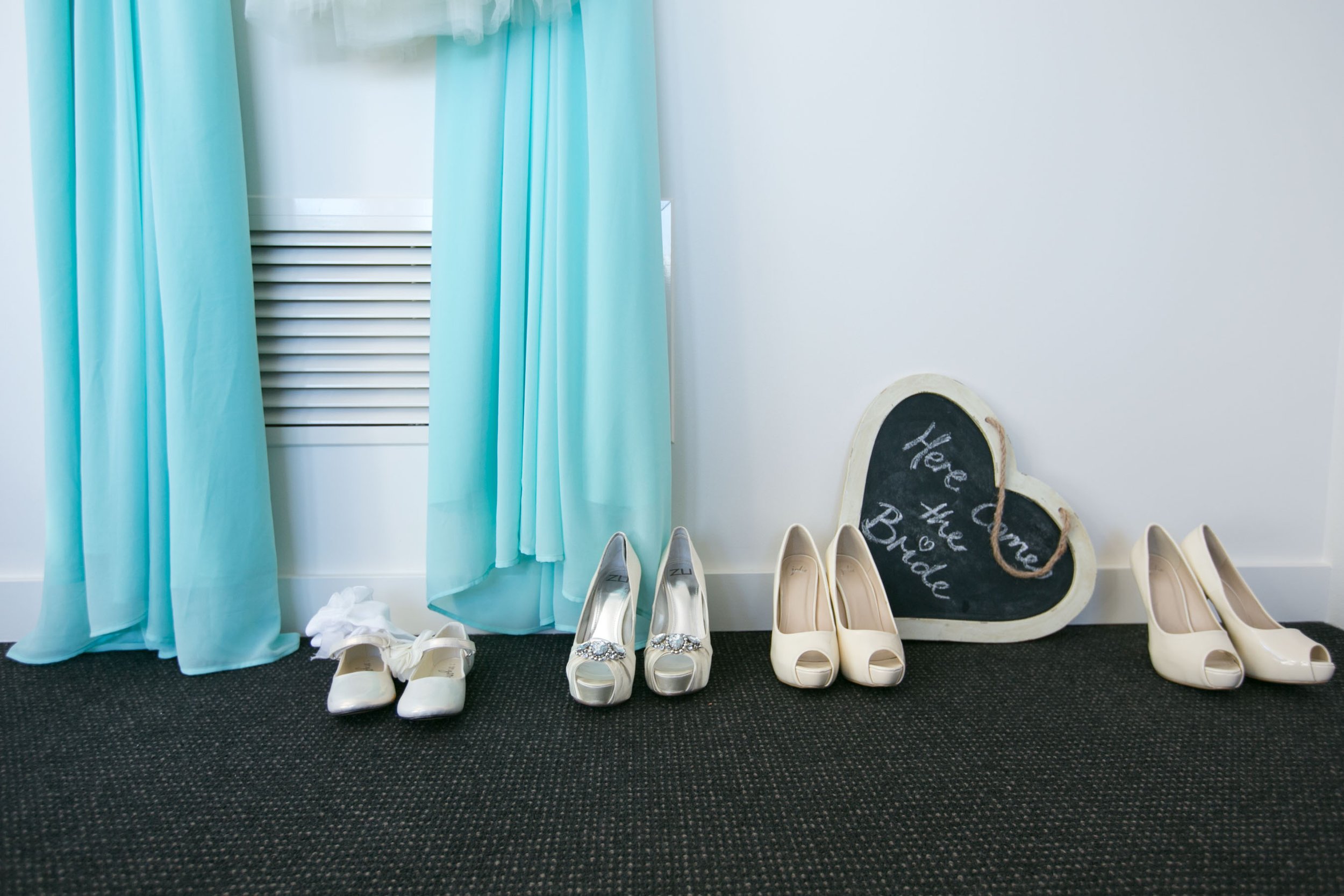 Final bridal preparation with teal shoes and details