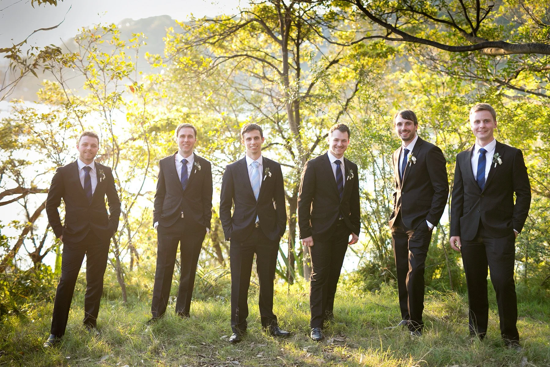Groomsmen group portrait standing in the bushland at Bradleys Head Mosman