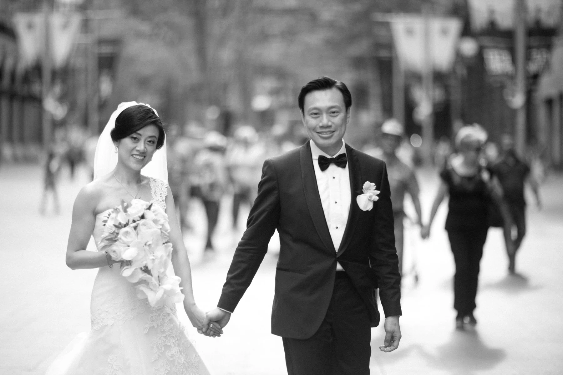Bride and groom walking hand in hand, Martin Place Sydney