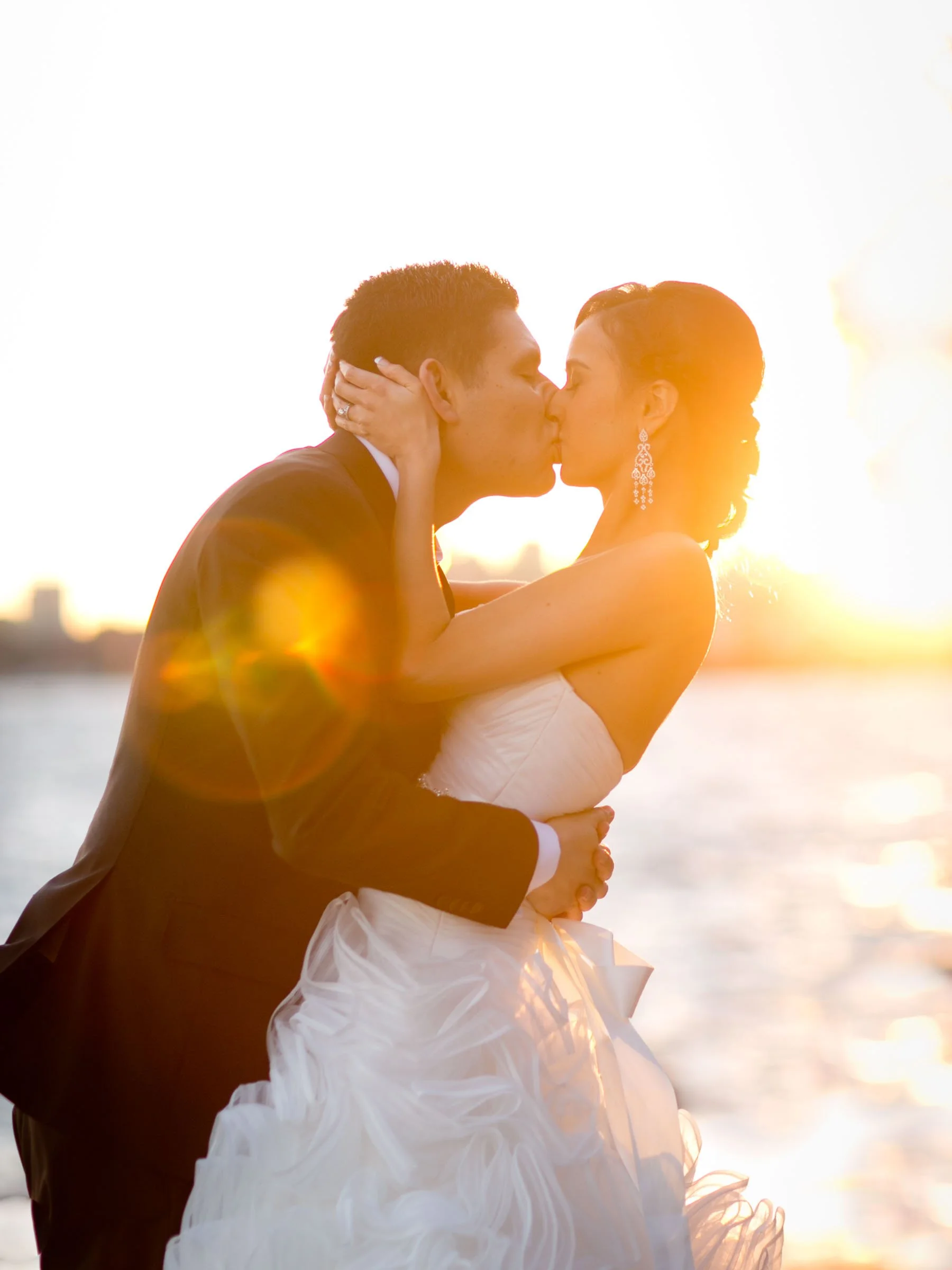 Bridal couple sunset kiss at Bradleys Head Mosman