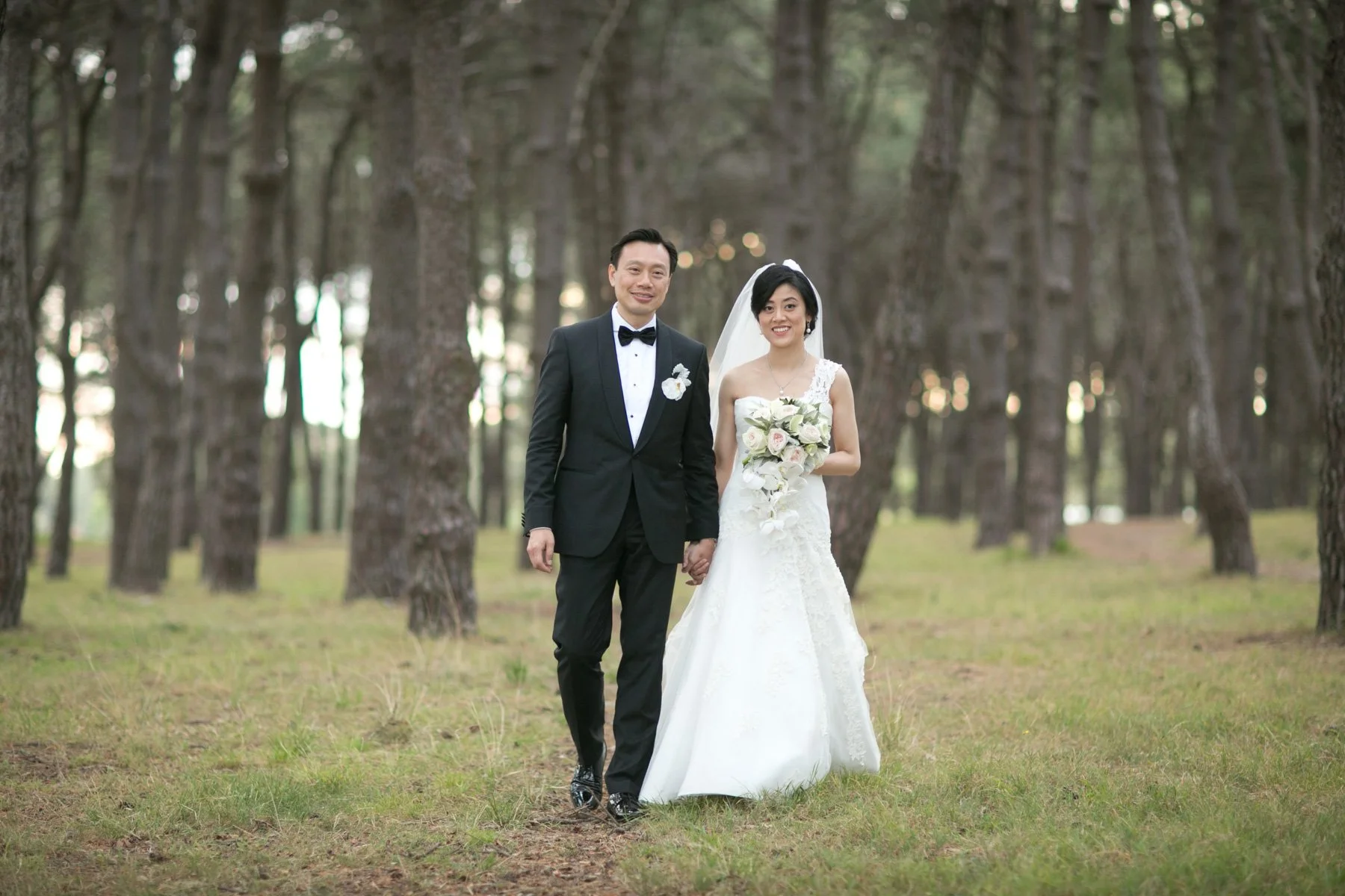 Bride and groom walking portrait in pine forest, Centennial Park Sydney