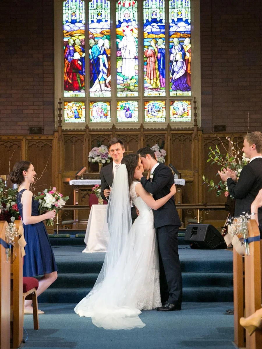 First kiss as husband and wife at the altar, St Andrews Anglican Church Roseville