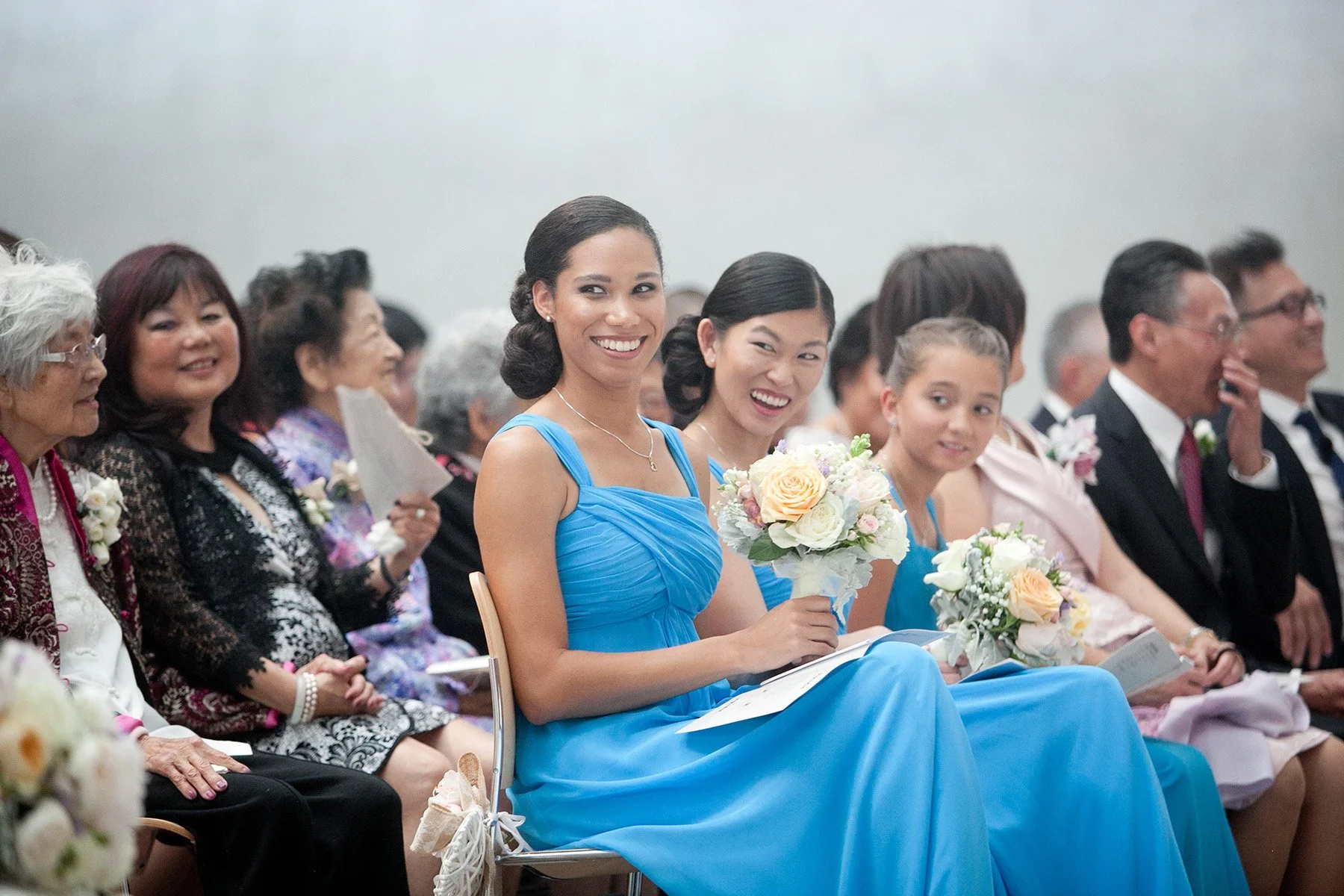 Bridesmaids smiling at bride during ceremony St Barnabas Broadway Ultimo Sydney