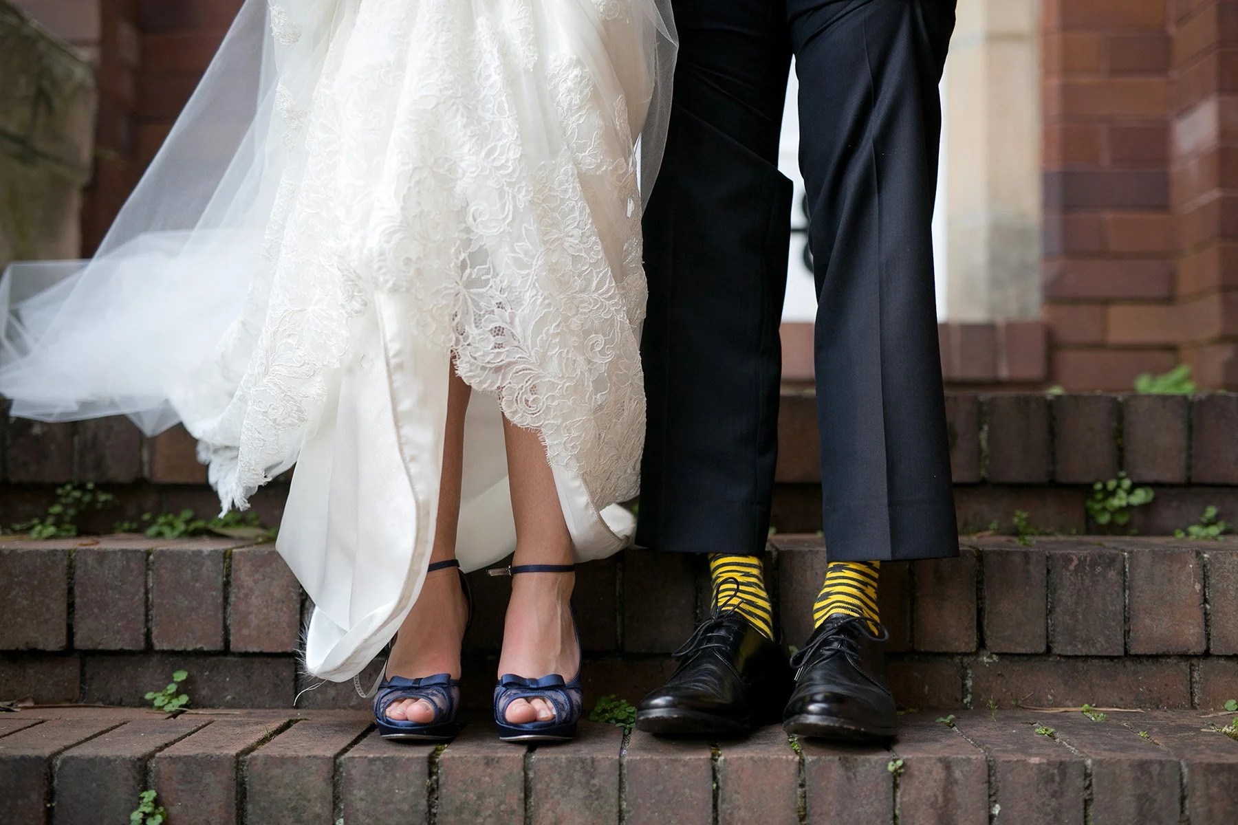 Close up of brides and grooms shoes on steps of St Andrews Anglican Church Roseville