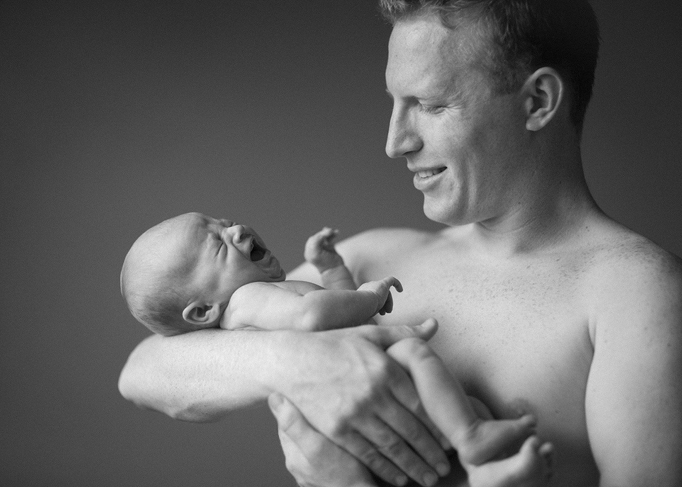 father-son-newborn-b&w-portrait.jpg