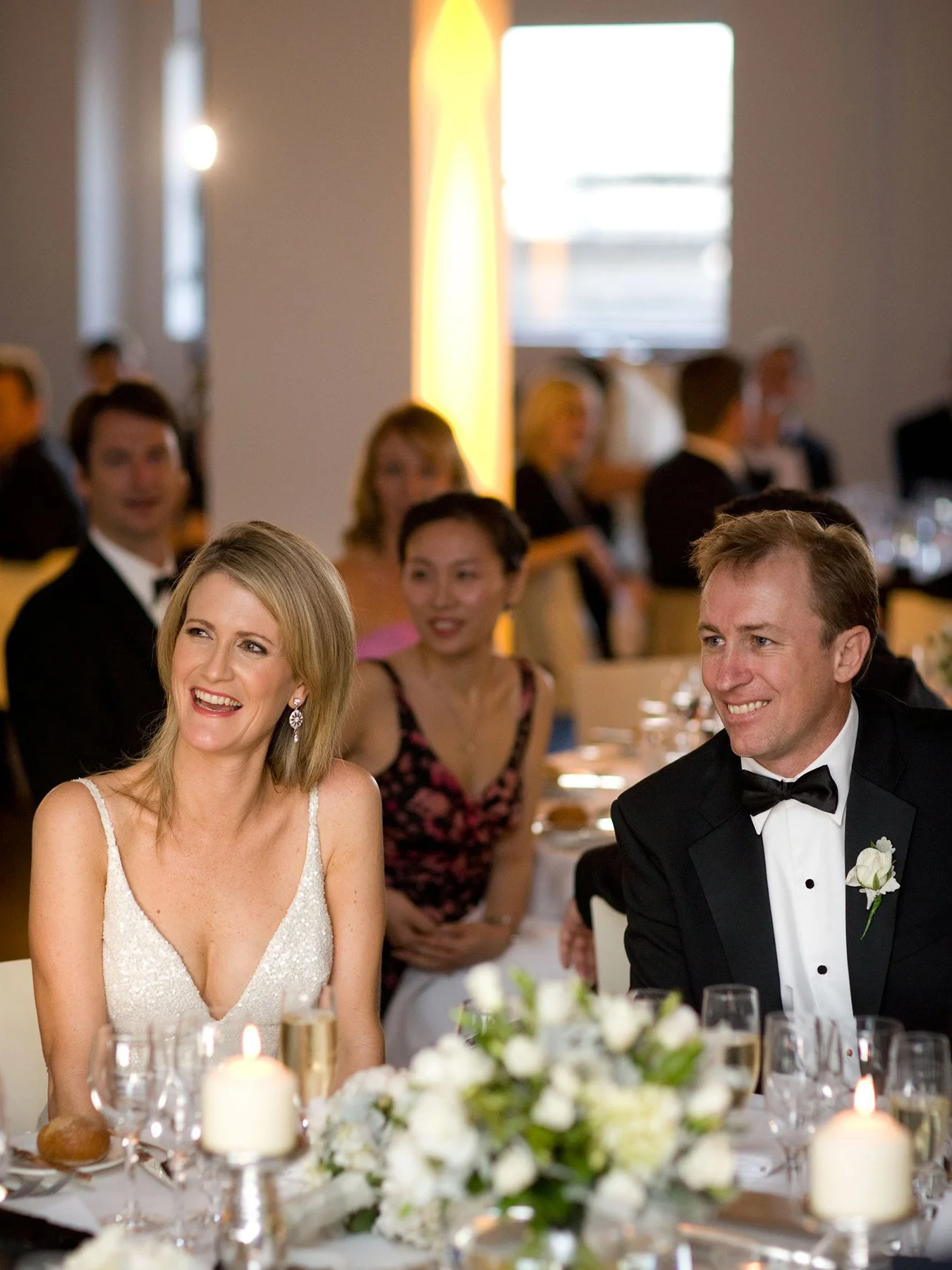 Bride and groom smiling together at the reception table, Museum of Contemporary Art Sydney