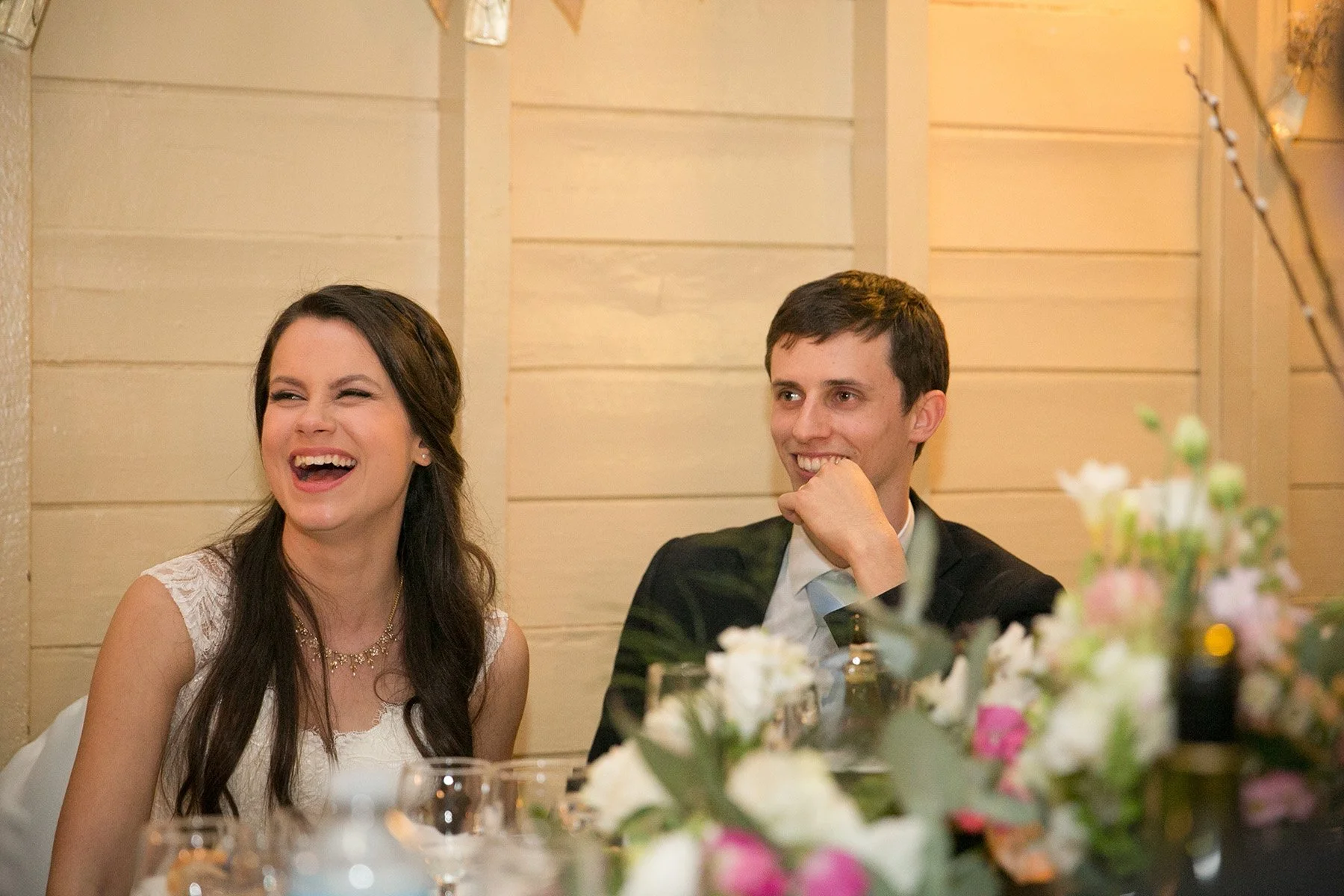 Bride and groom laughing together at the bridal table, Athol Hall Mosman