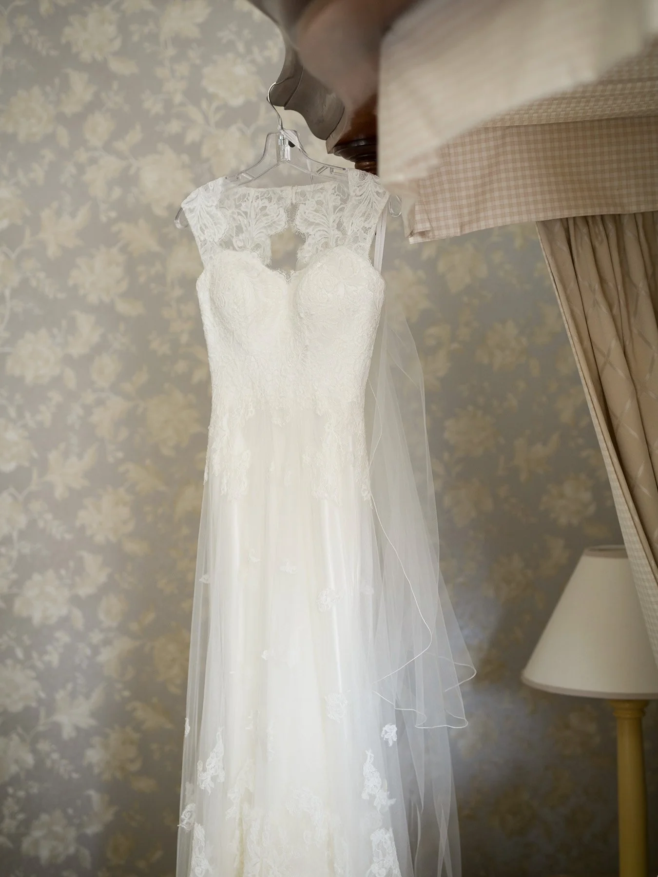 Wedding dress hanging in the room before the ceremony