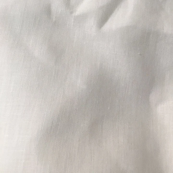 Close-up of crumpled white fabric or paper.