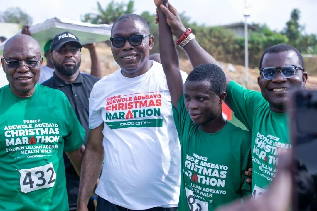 Prince Adewole Adebayo celebrating with participants at his Christmas Day Marathon in Ondo, December 2025