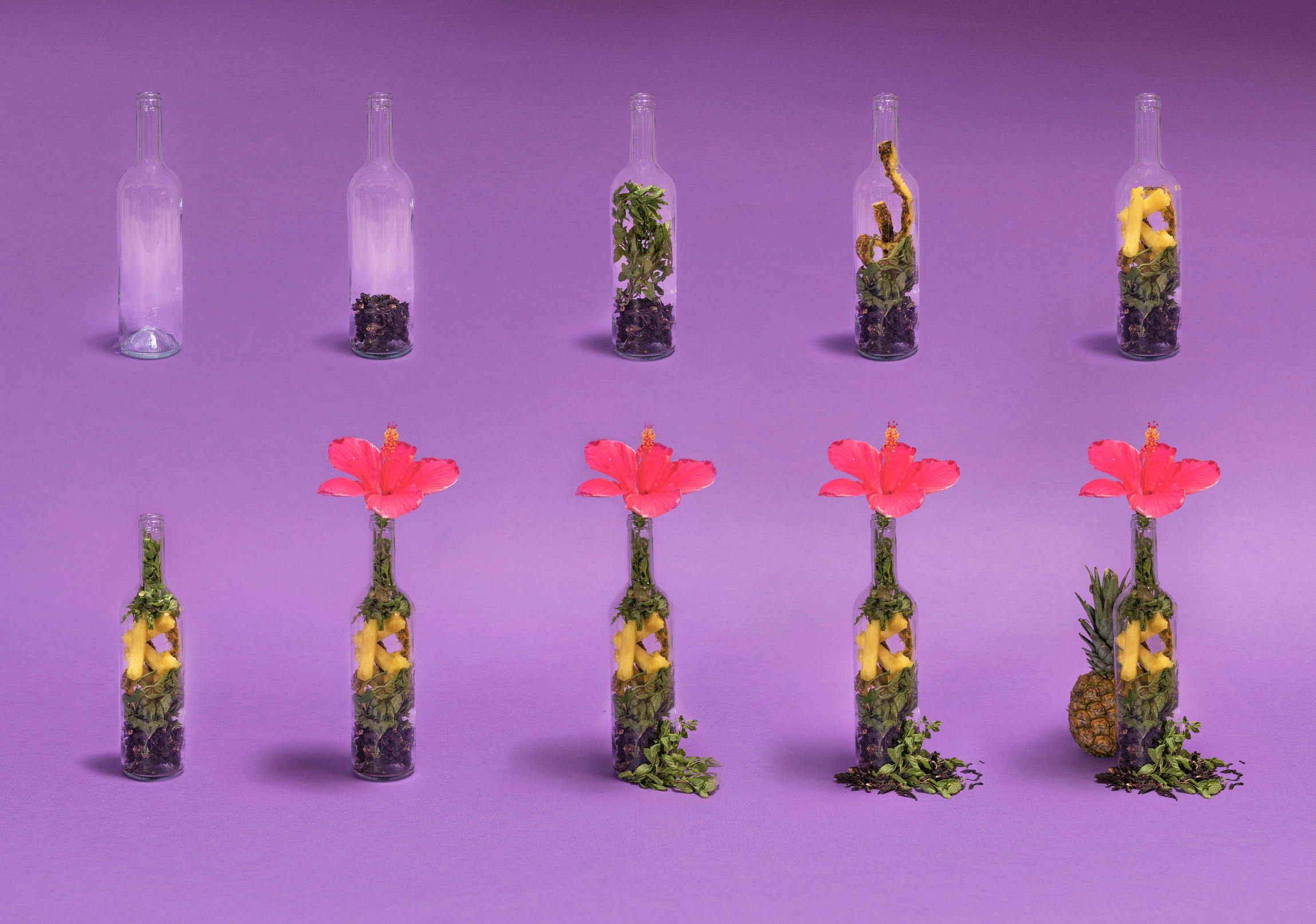 Series of glass bottles arranged in a grid with increasing contents, from empty to filled with flowers, herbs, pineapple, and fruit, set against a purple background.