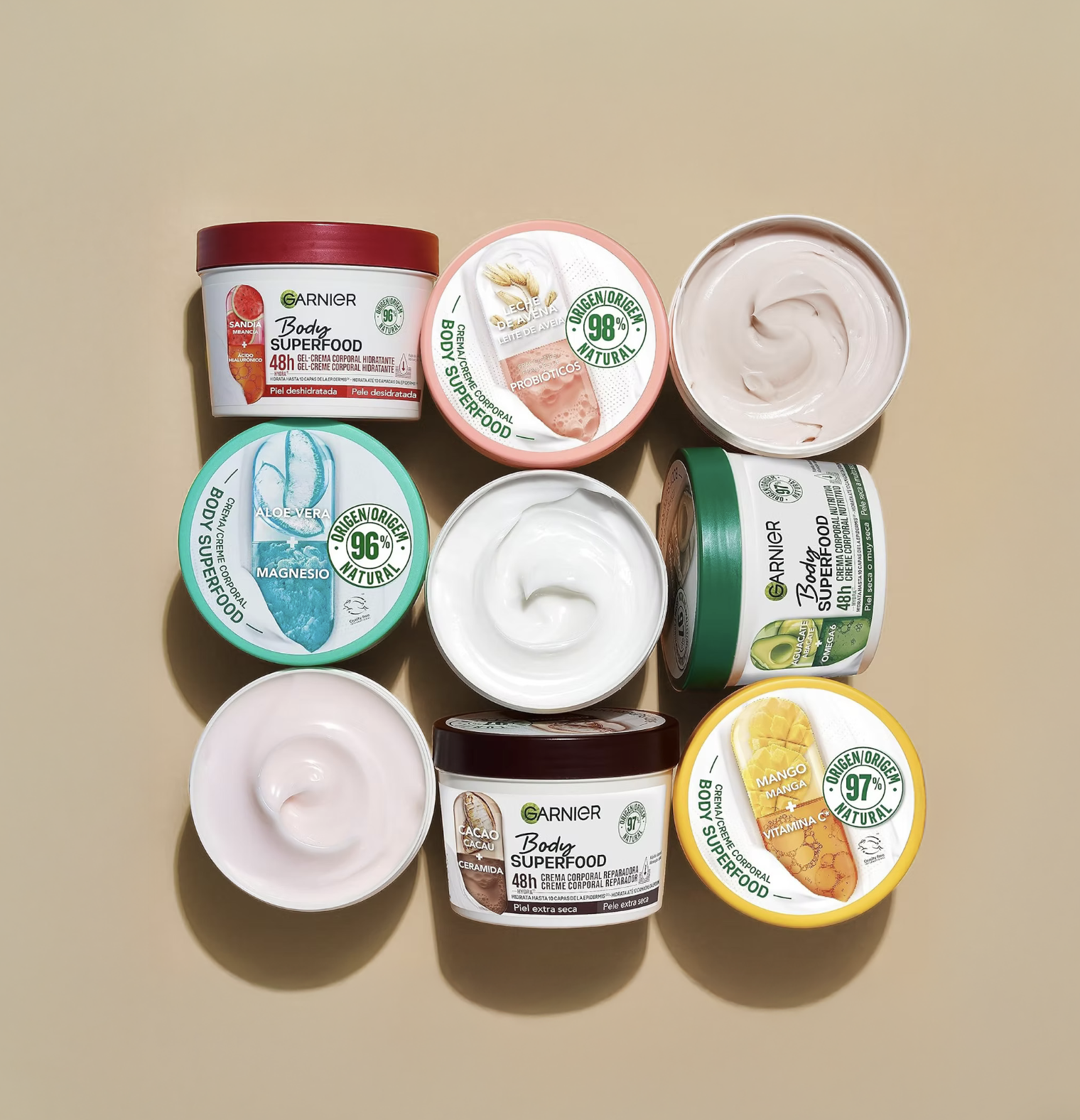 Flat lay of Garnier Body Superfood hydrating cream collection packaging.