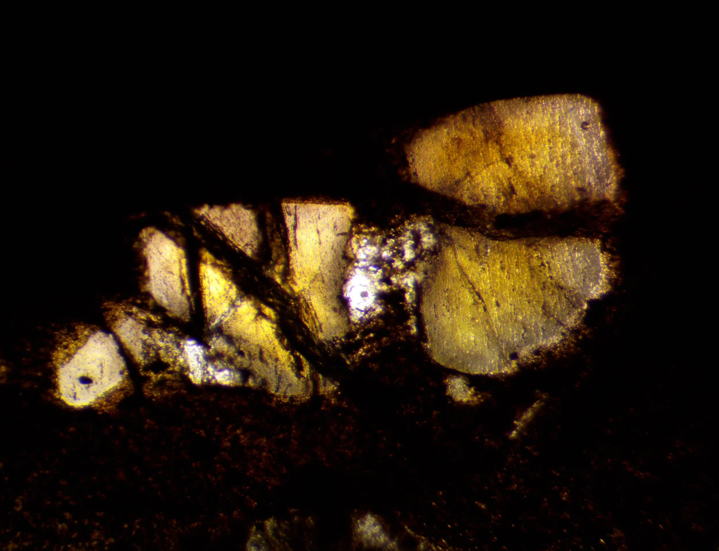 The polished section of the Llano rhyolite (Texas, USA) from the previous image, showing the color change in transmitted light.