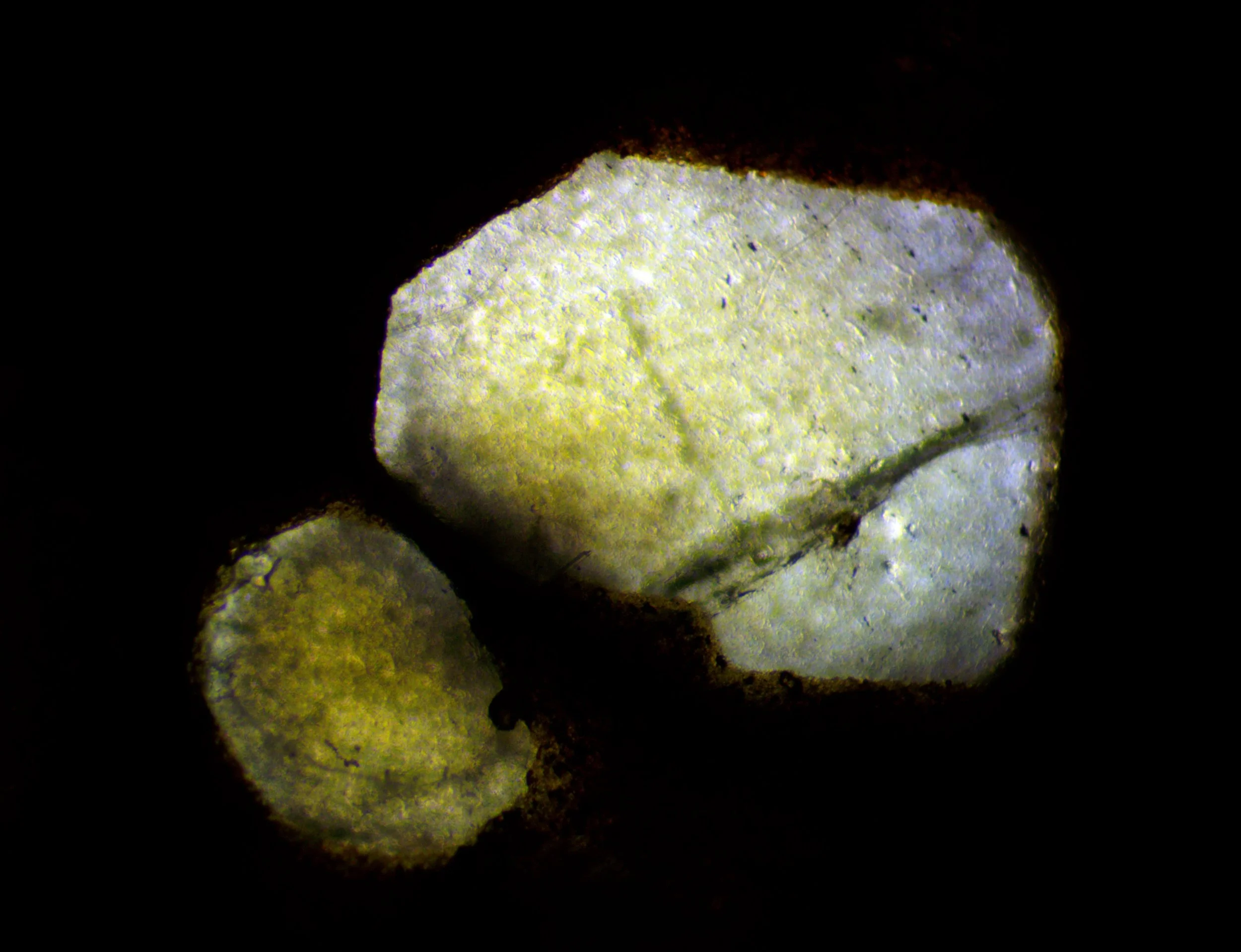 The polished section of the Llano rhyolite (Texas, USA) from the previous image, showing the color change in transmitted light.