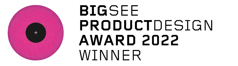 Close-up of a target with concentric circles and a pink outer ring, used for archery or shooting practice, with a small flash of LED light near it.