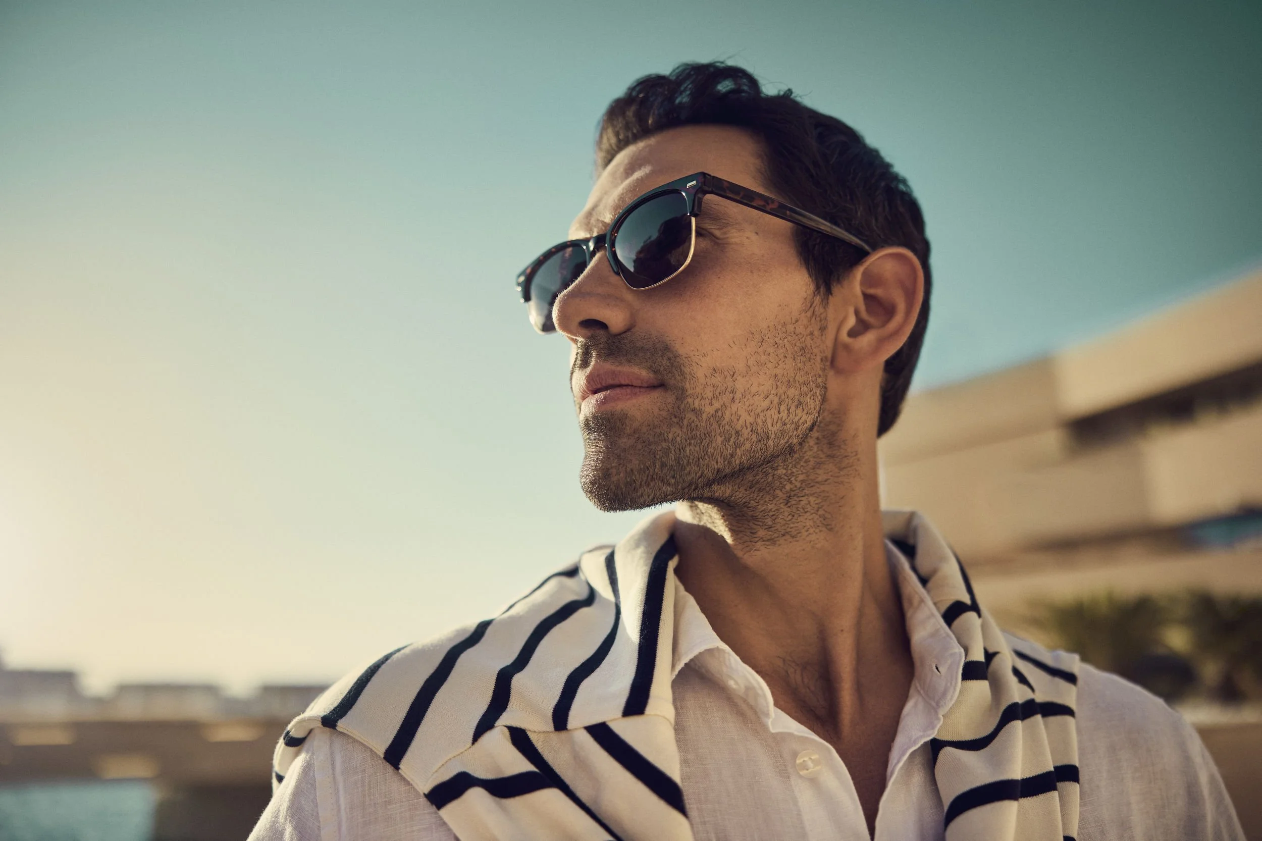 Lifestyle images shot for the Saudi Neom project featuring their Red Sea luxury holiday island in this image a man wears his sunglasses