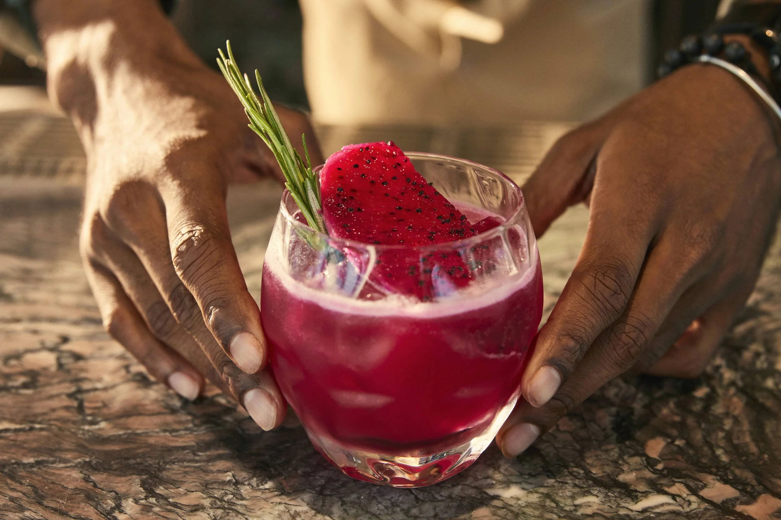 A barman finishes a cocktail in this lifestyle image shot for the Saudi Neom project featuring their Red Sea luxury holiday island