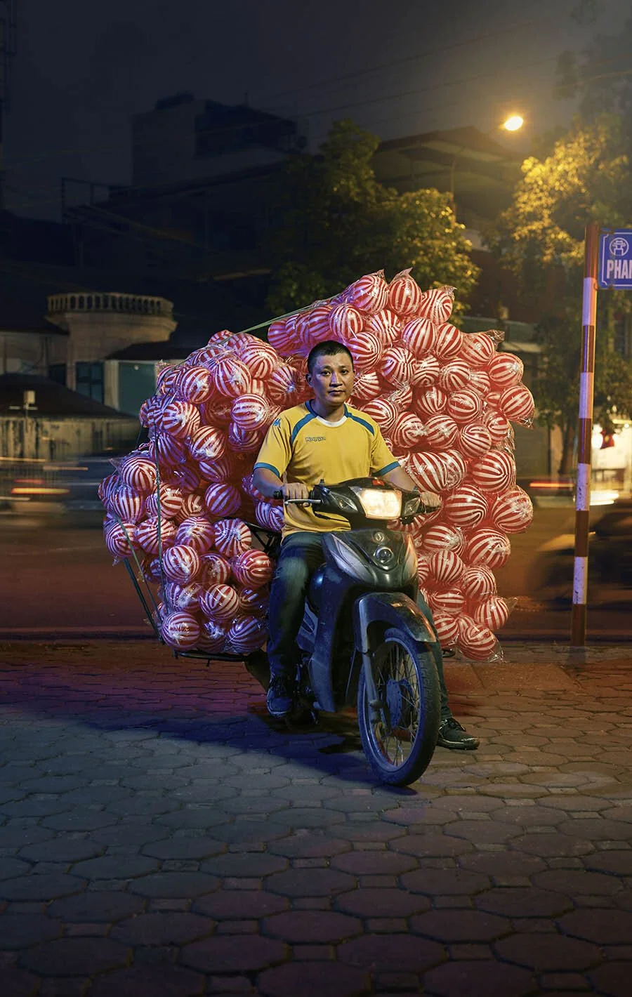 Advertising photographer Jon Enoch’s latest project ‘Bikes of Hanoi’ showing motorbikes carry goods around the city of Hanoi, Vietnam.