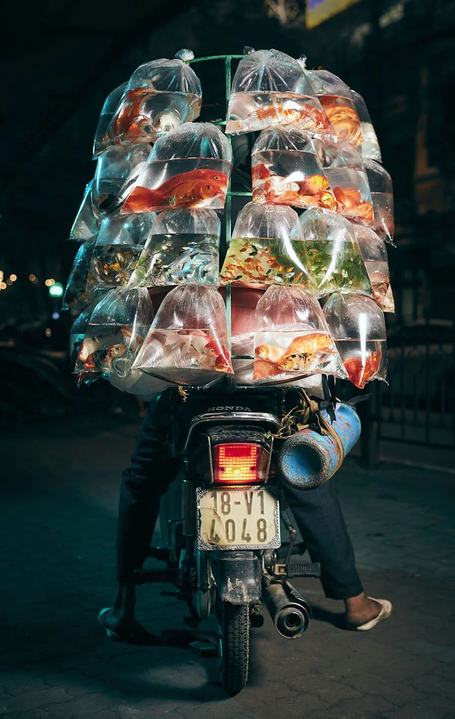 Advertising photographer Jon Enoch’s latest project ‘Bikes of Hanoi’ showing motorbikes carry goods around the city of Hanoi, Vietnam.