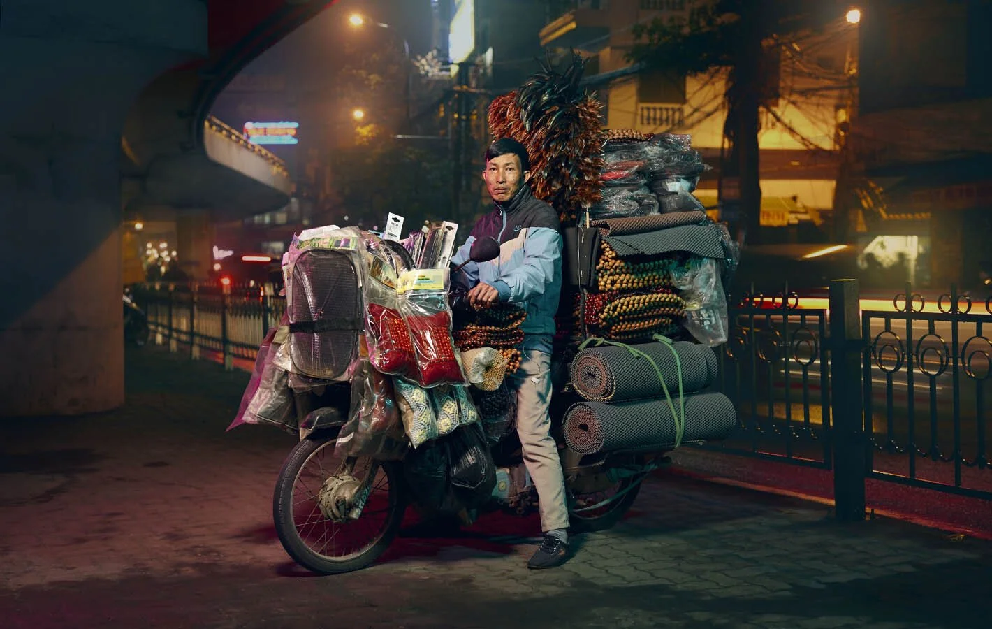 Advertising photographer Jon Enoch’s latest project ‘Bikes of Hanoi’ showing motorbikes carry goods around the city of Hanoi, Vietnam.
