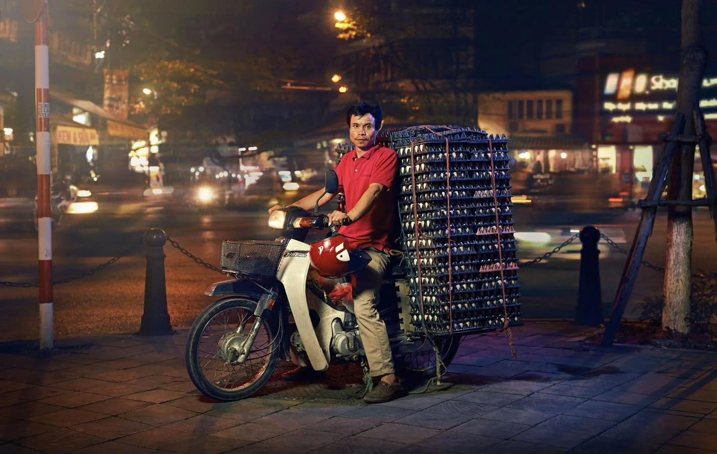 Advertising photographer Jon Enoch’s latest project ‘Bikes of Hanoi’ showing motorbikes carry goods around the city of Hanoi, Vietnam.