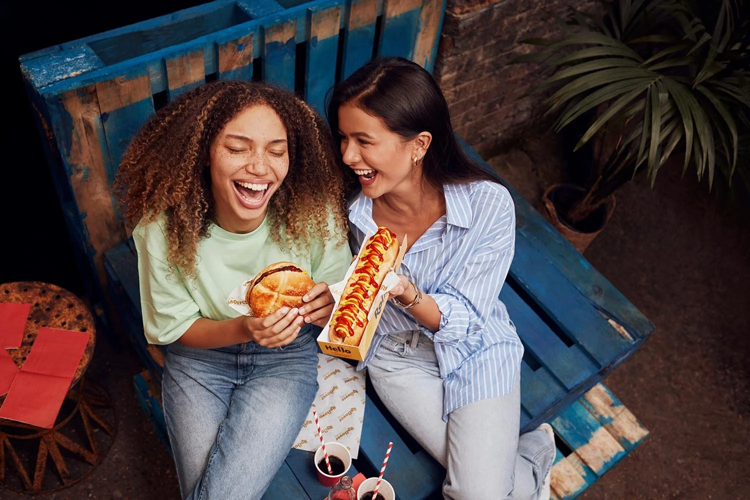 Lifestyle photographer Jon Enoch captures two friends enjoying some food at a street market
