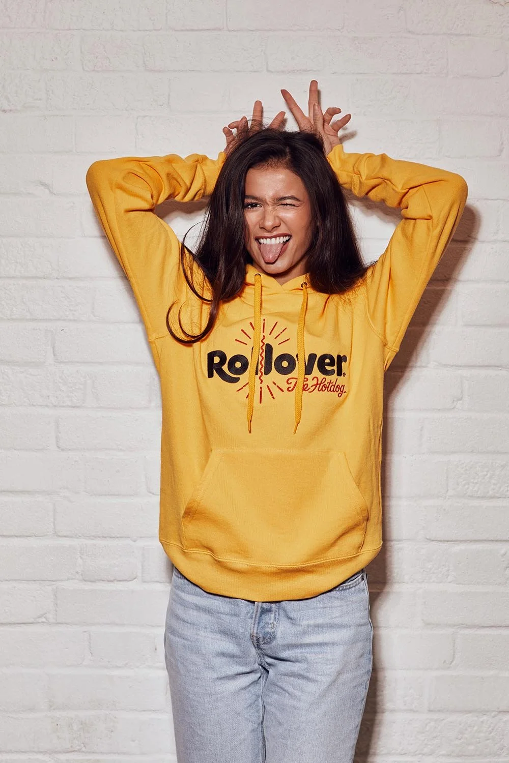 A young men poses in a hello hoodie by lifestyle photographer Jon Enoch.