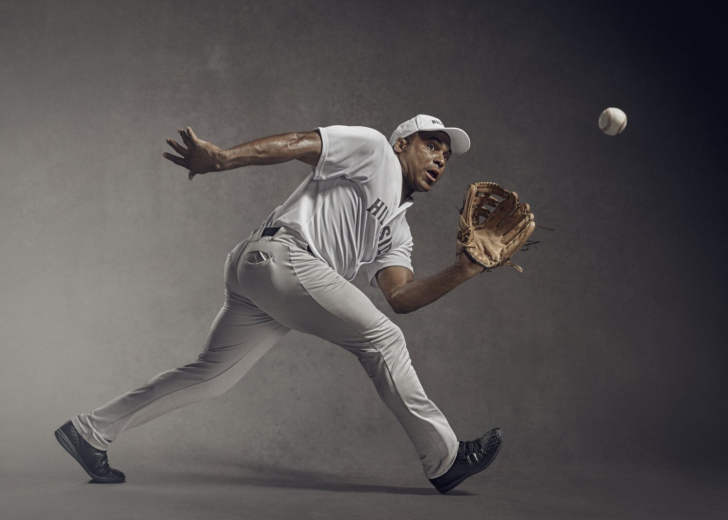 Jon Enoch a leading sports photographer captures a baseball player in action in this studio advertising shoot