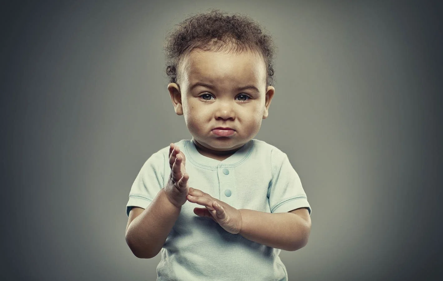 Studio portrait of a baby taken by advertising portrait photographer Jon Enoch.