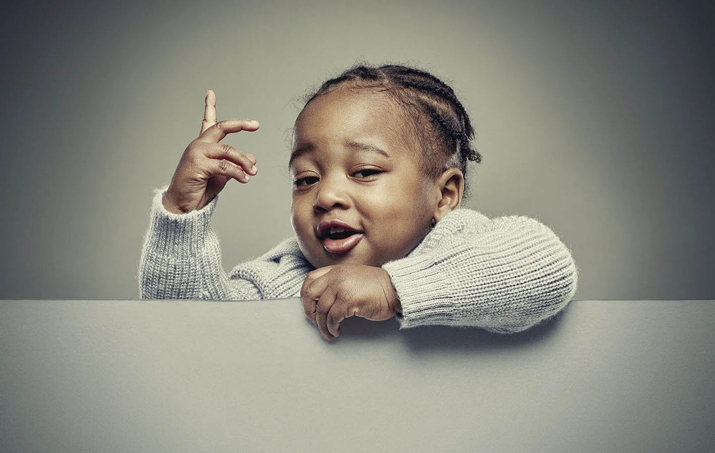 Studio portrait of a baby taken by advertising portrait photographer Jon Enoch.