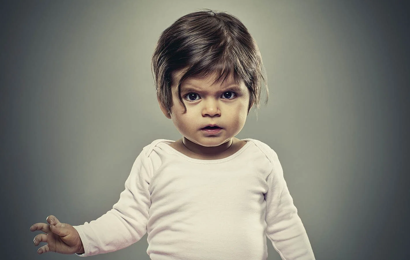 Studio portrait of a baby taken by advertising portrait photographer Jon Enoch.