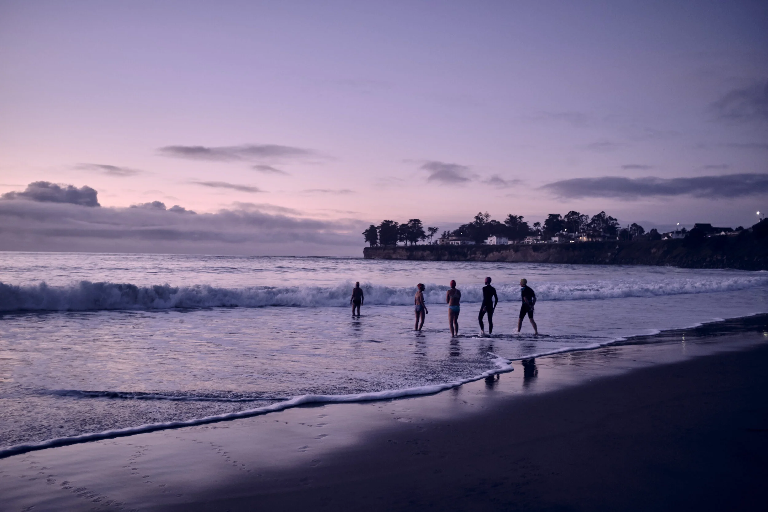 Swimmer head into the water - image by lifestyle photographer Jon Enoch