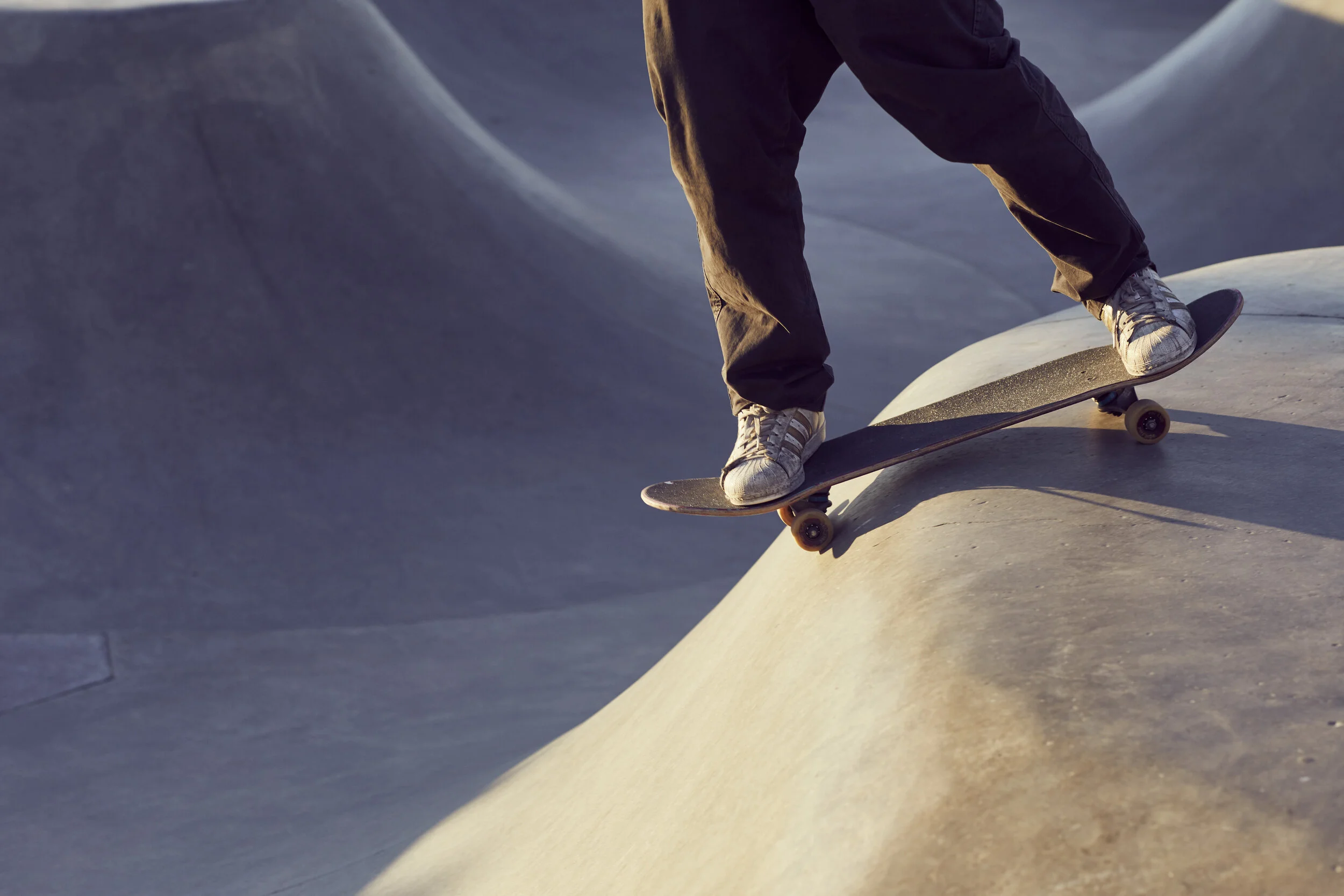 Skater rides in a skate park- image by lifestyle photographer Jon Enoch
