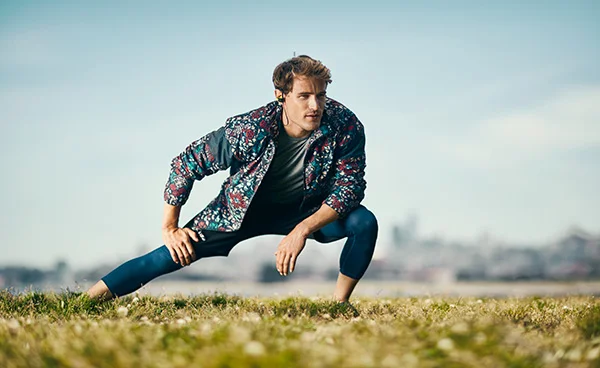 A man warms up for a run wearing sportswear in this image taken by Sport Advertising photographer Jon Enoch.