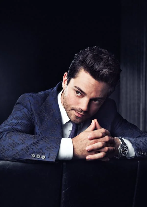 A portait of Dominic Cooper wearing a suit by advertising photographer Jon Enoch.