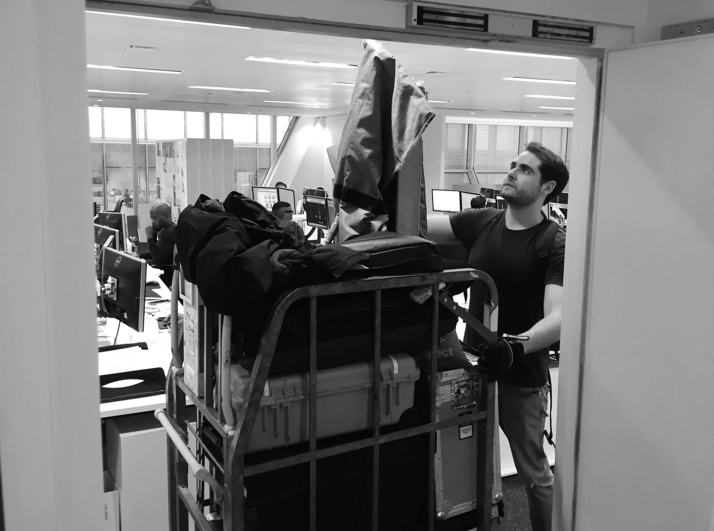 A behind the scenes image of photographer Jon Enoch setting up for a shoot.