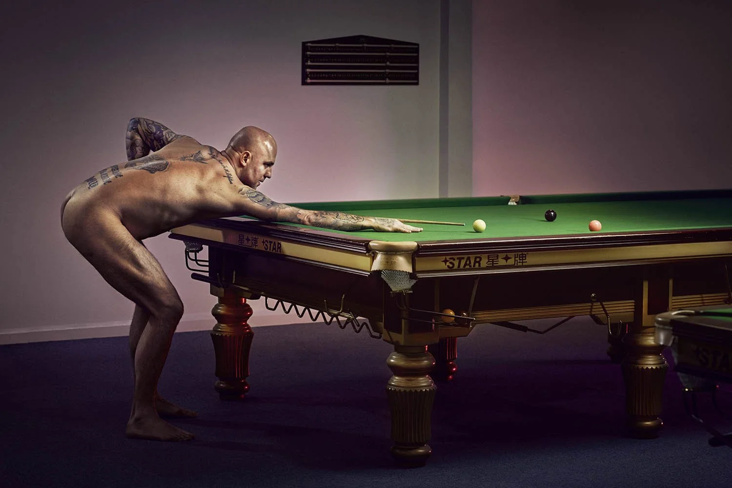 mark king playing snooker naked poses naked. Photography by Jon Enoch sports advertising photographer.