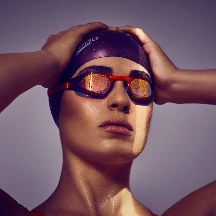 A swimmer wears goggles and a swimming cap in this adverting image from photographer Jon Enoch