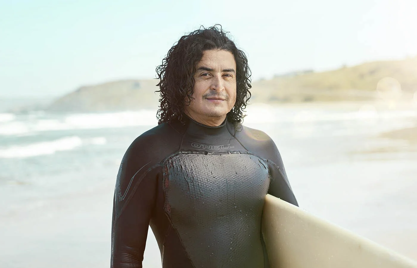 A portrait of a surfer in California by sport advertising photographer Jon Enoch.