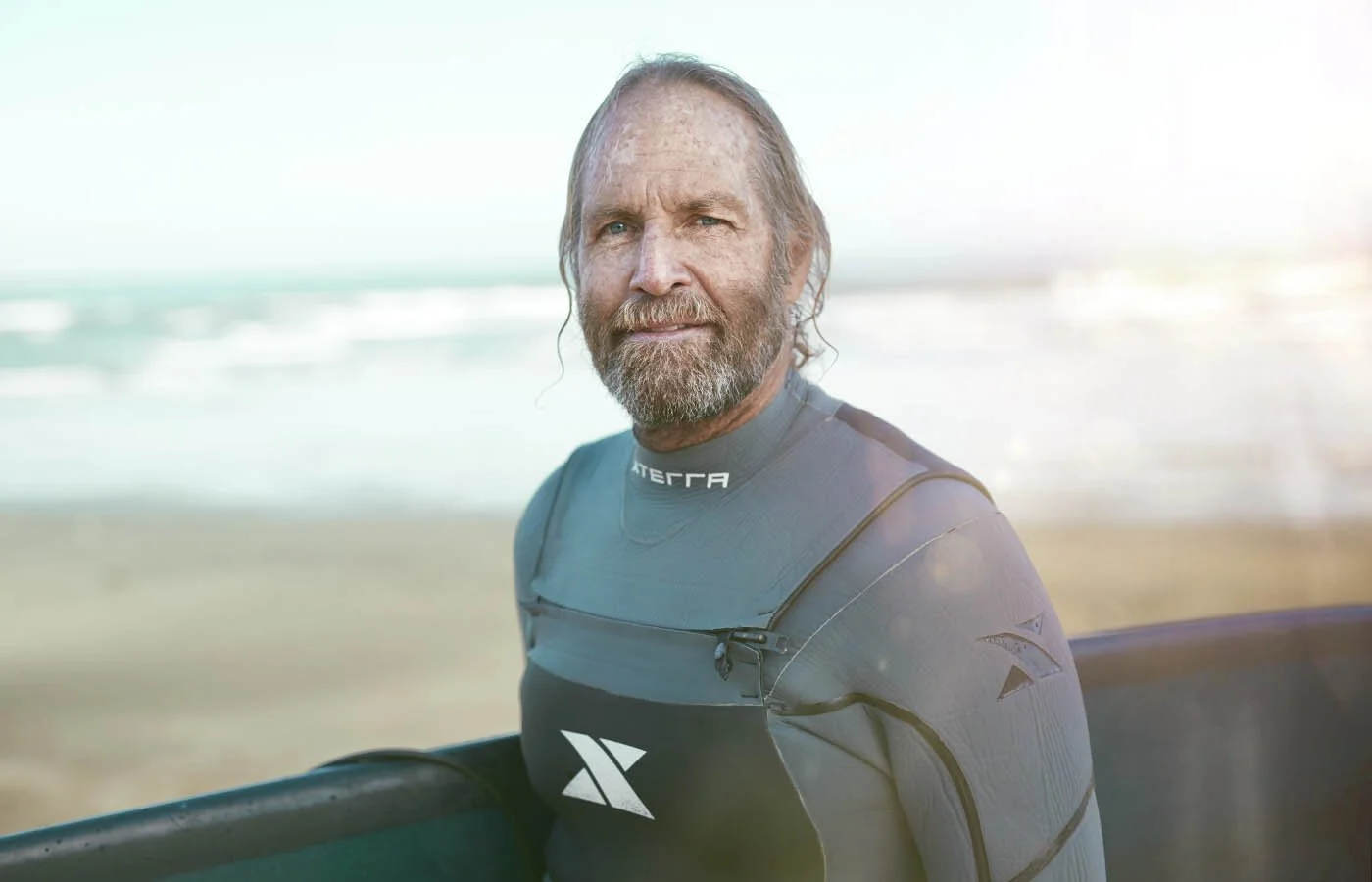 A surfer enjoys an early morning surf in California in this lifestyle image by photographer Jon Enoch.