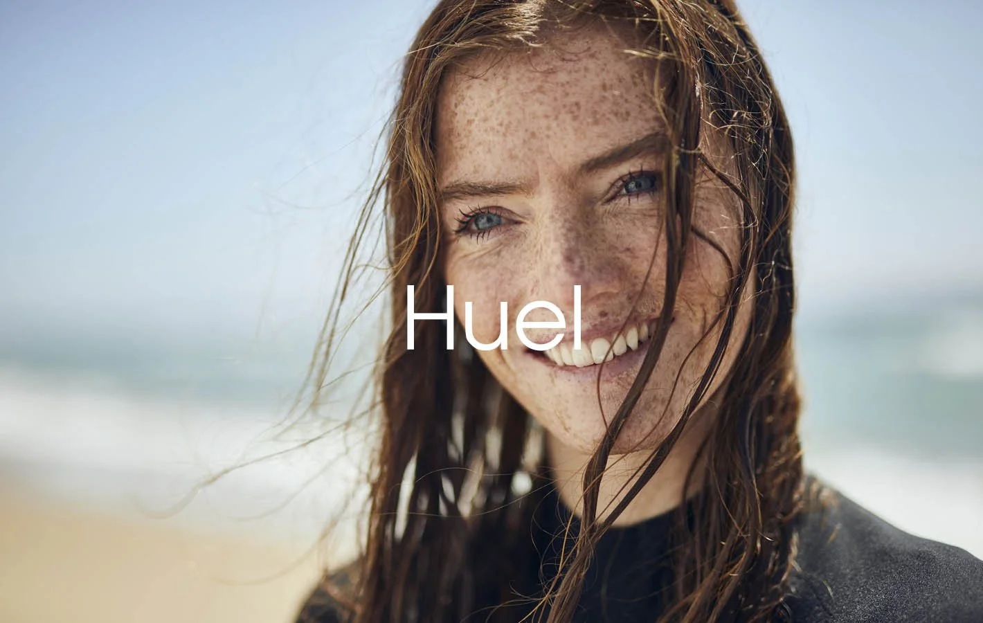 A surfer pictured on the beach in this image for meal replacement first Huel by photographer Jon Enoch