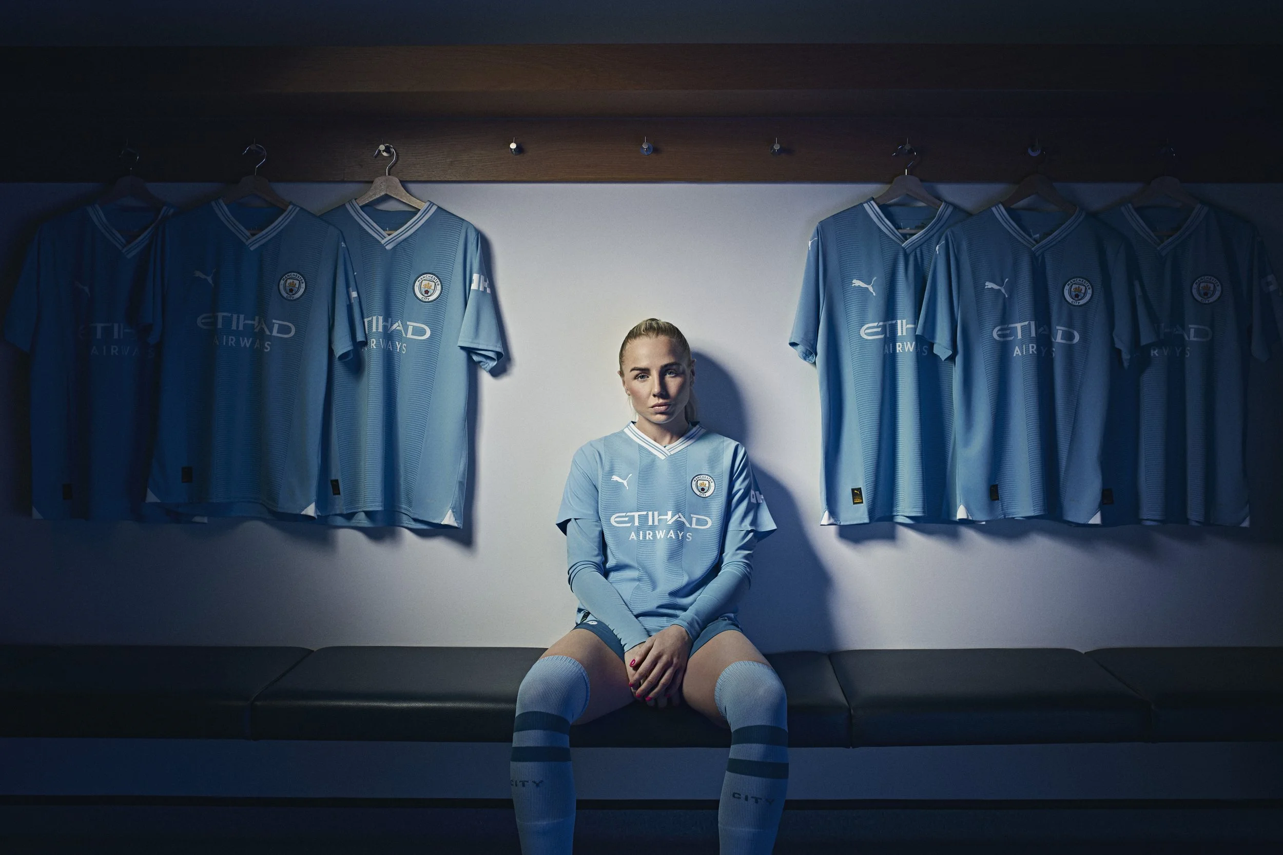 Footballer Alex Greenwood sits in her dressing room in this iamge by sports photographer Jon Enoch