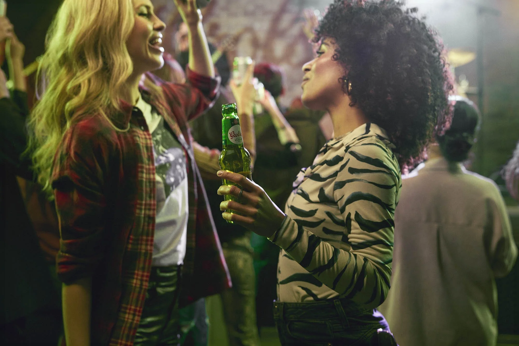 Friend dance, enjoying live music and beer in this lifestyle image by photographer Jon Enoch