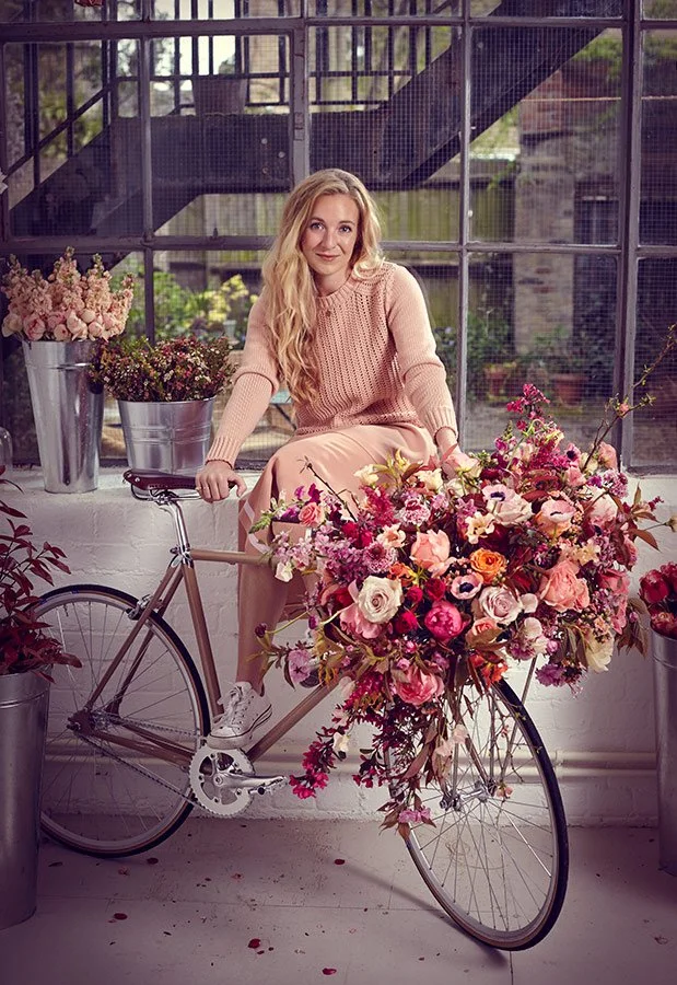 Lifestyle portrait, a woman with a bicycle