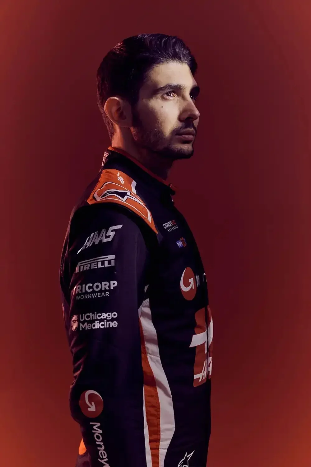 Sports advertising portrait of Haas F1 Team driver Esteban Ocon photographed for a motorsport marketing campaign.