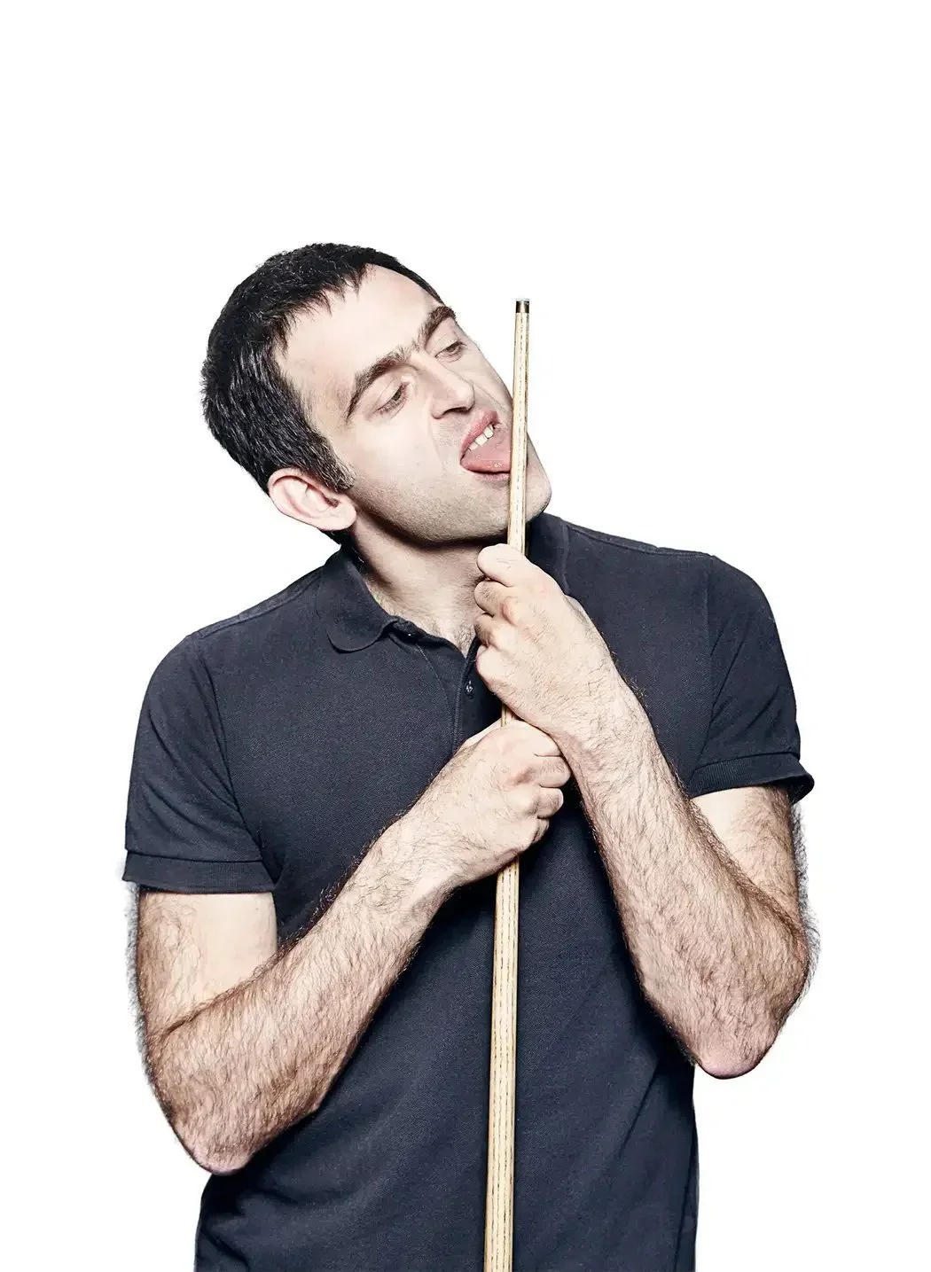 Ronnie O'Sullivan, multiple-time World Snooker Champion, photographed in a playful portrait that reflects the personality, confidence and natural talent that have made him one of the sport's most influential figures.